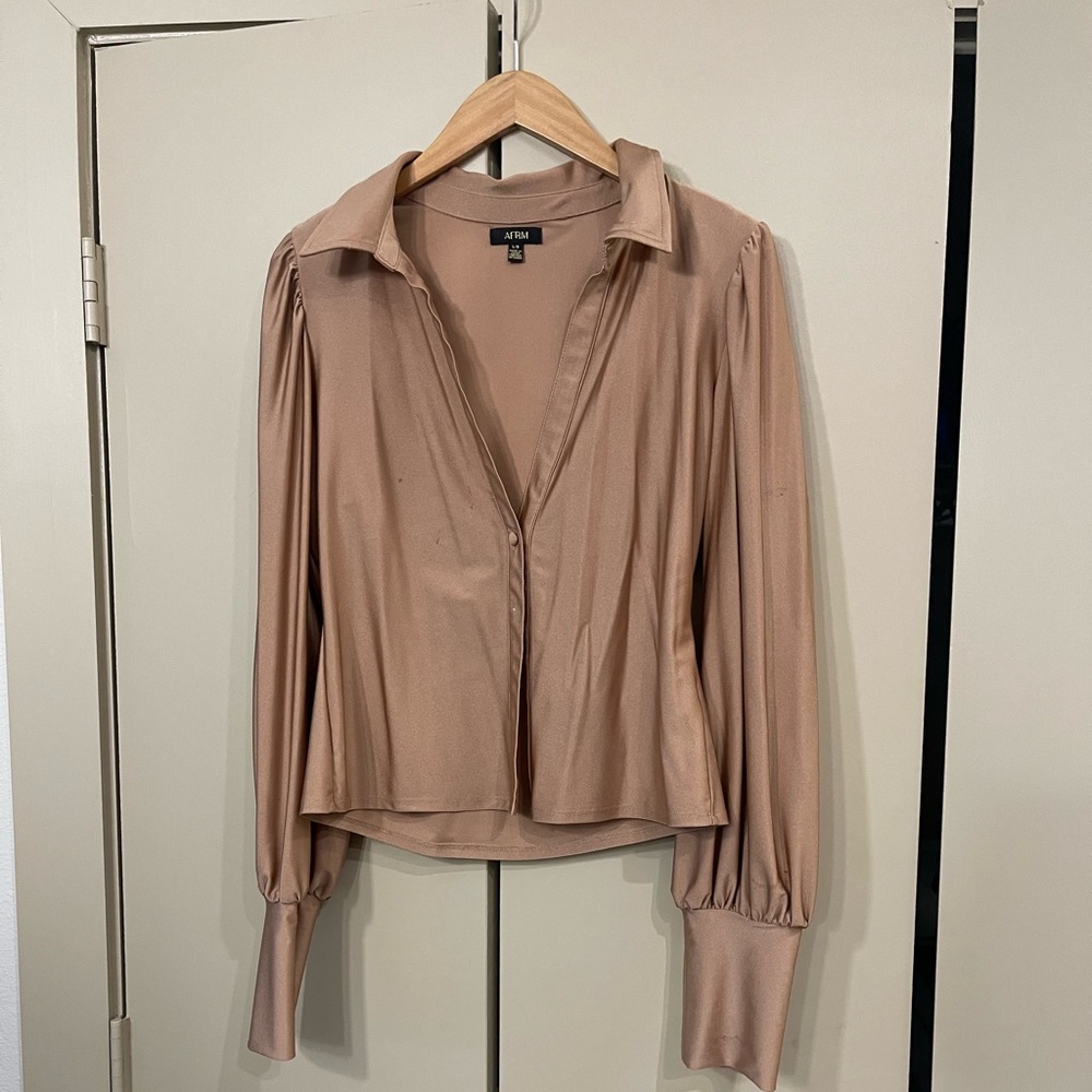 Revolve going out top